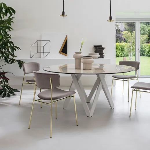 Tavolo rotondo con piano in ceramica effetto marmo Cartesio di Calligaris