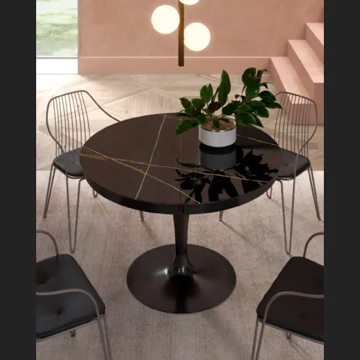 Tavolo rotondo allungabile Eclipse con top in marble glass Sahara Noir Lucido di Ozzio